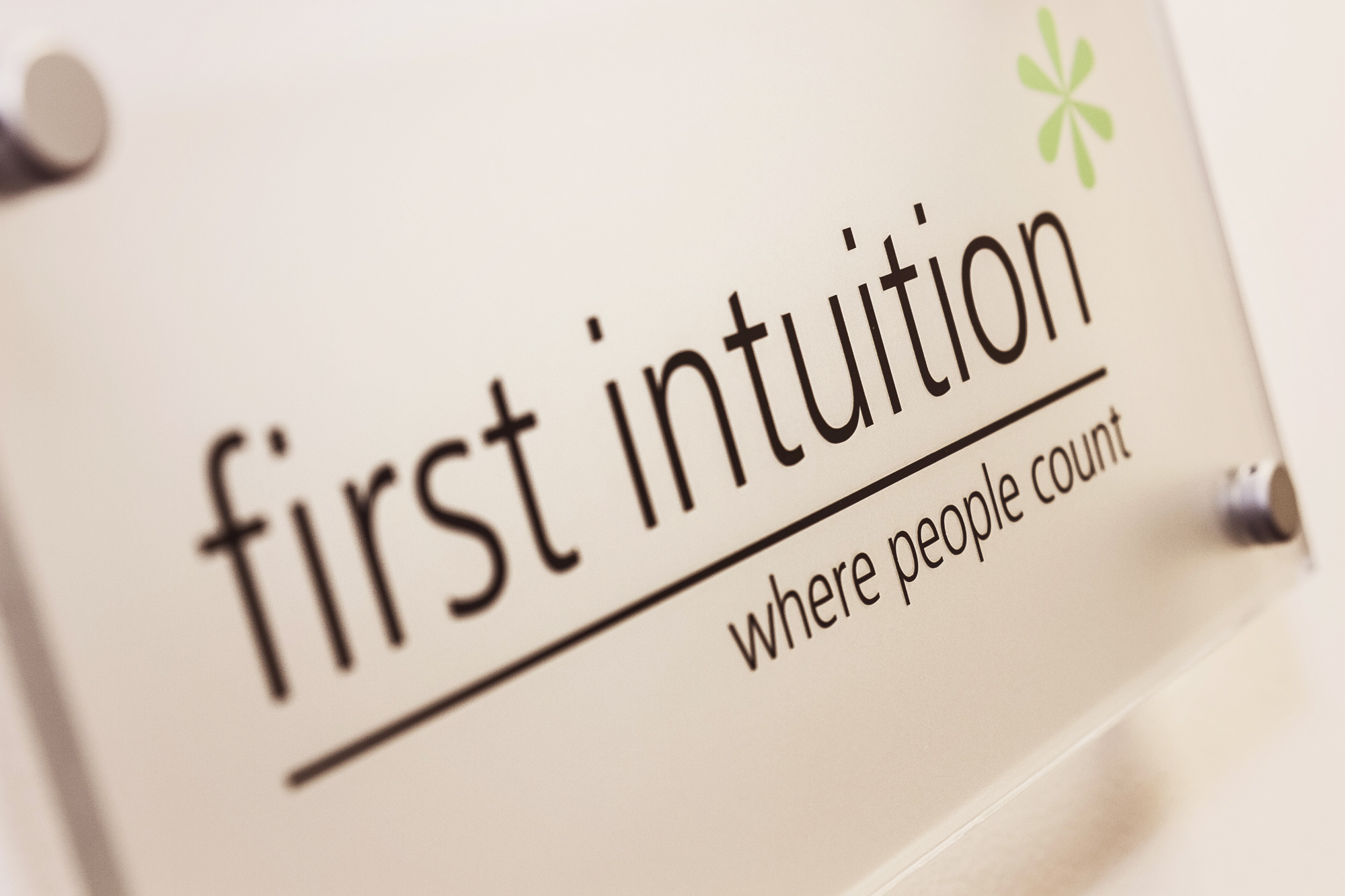 First Intuition logo on sign