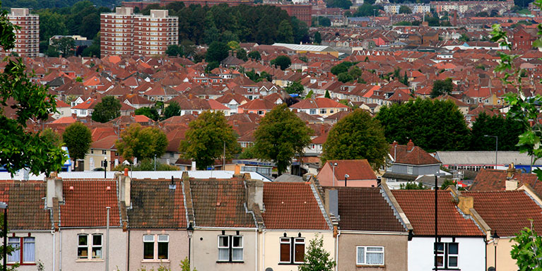 View of housing rooftops and flats over Bristol.